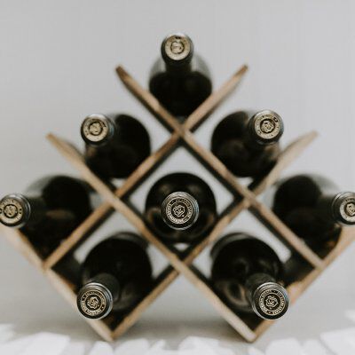 eight wine bottles in a wine rack